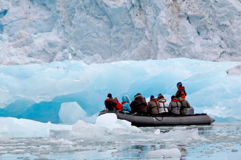 Group of people on a dingy boat doing an expedition. 