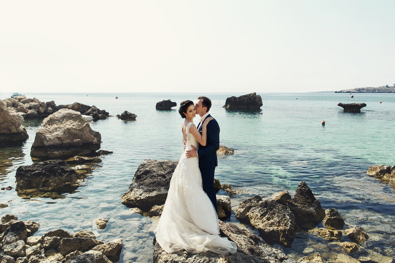 Bride and groom on romantic beach